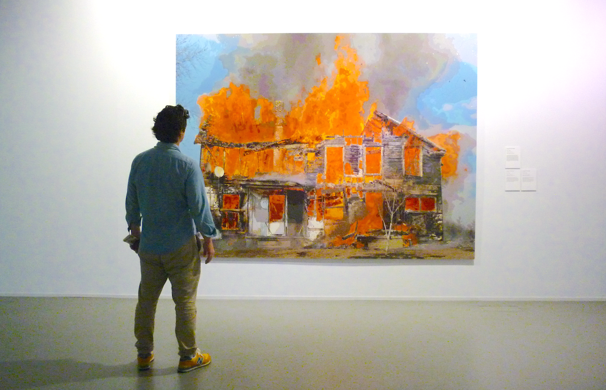 Painting горящий человек. Man looking at Painting. Man and Burning House Art. Man looking in album for Painting.