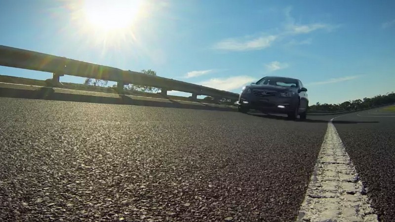 Holden car driving along road test track